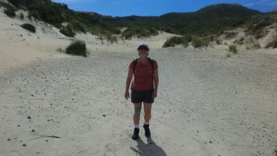 Saira in the little sandy canyon.